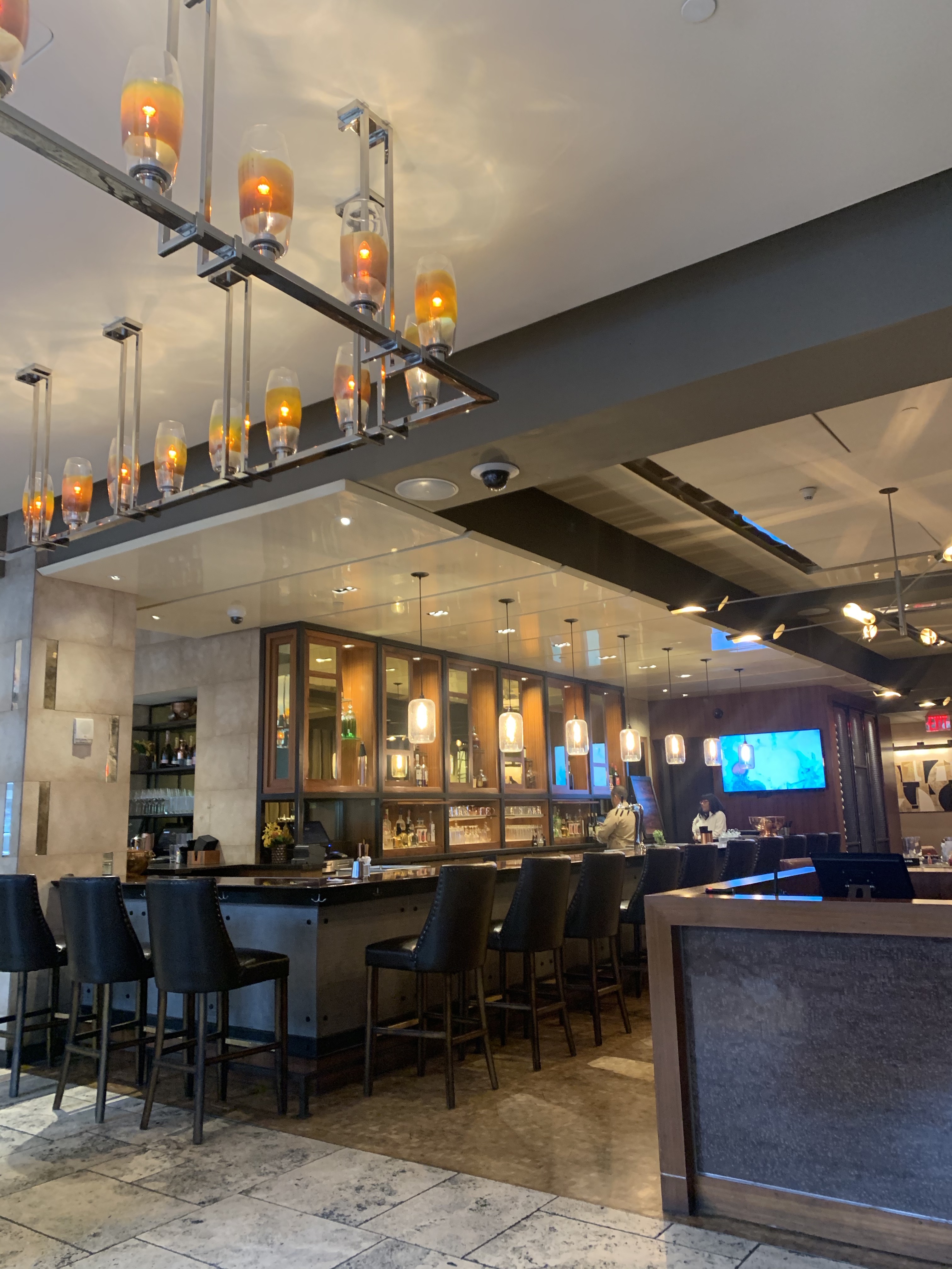 photo of the stinger bar and kitchen. brown and gold vibes .