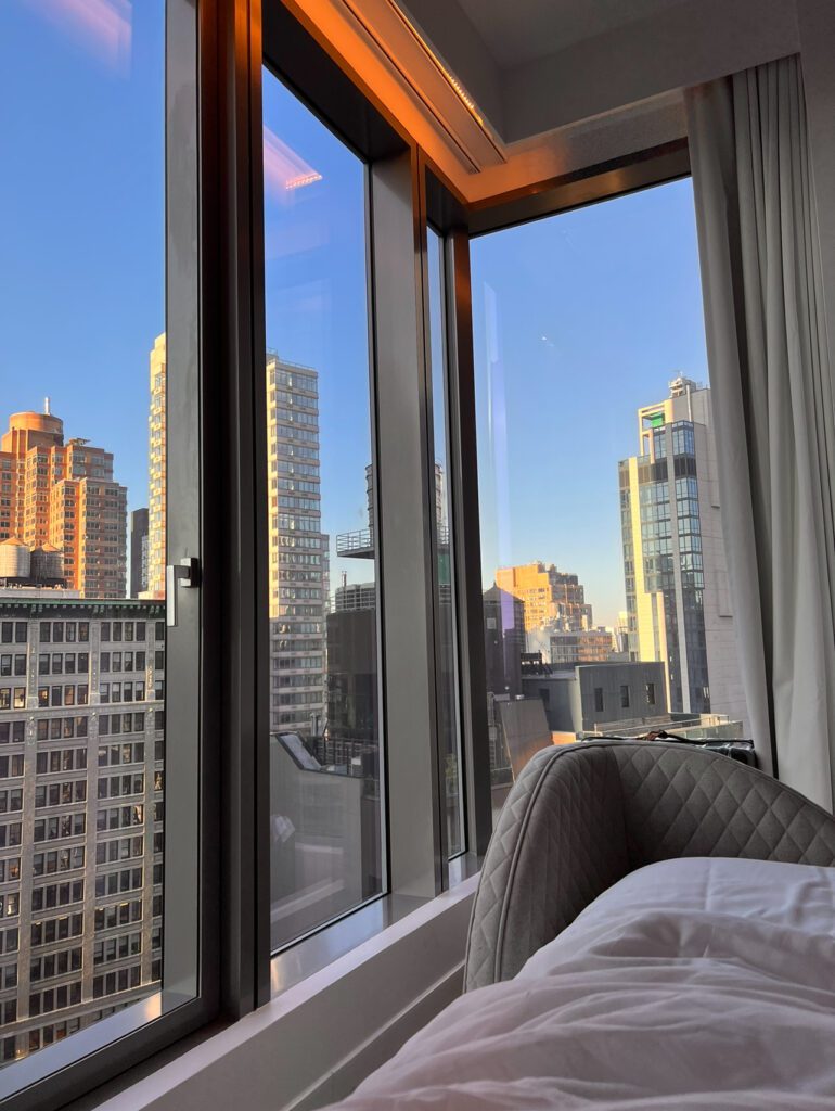 photo of the view from my virgin hotel bed. It shows the skyline of new york