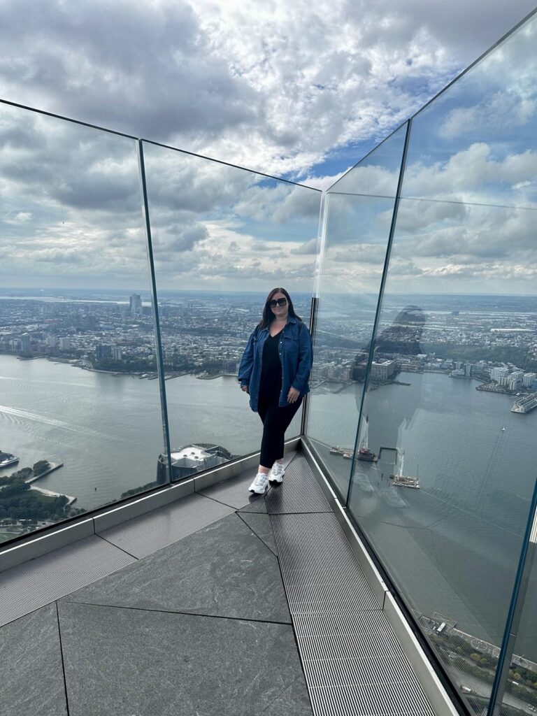 photo of hannah in new york at "the edge" with the hudson river in the background behind her